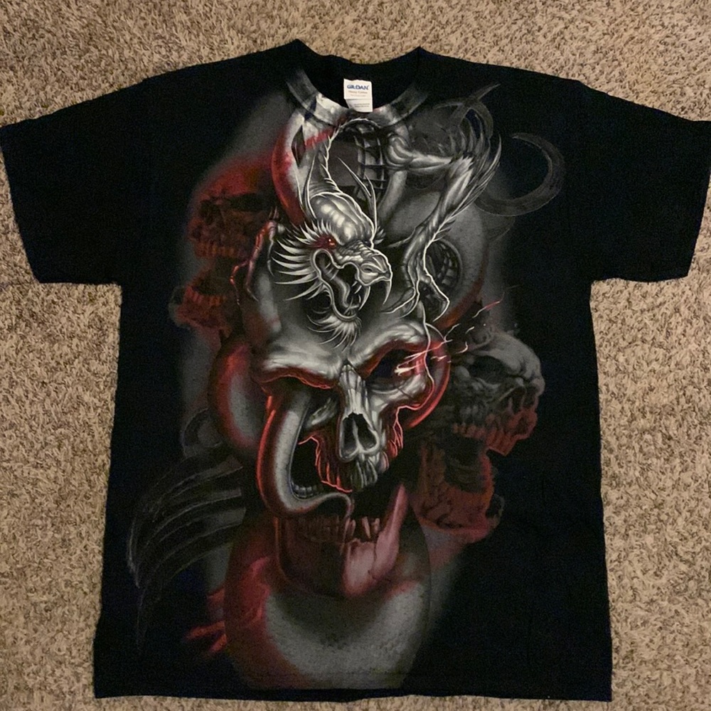 Large t-shirt with dragon and skull print.